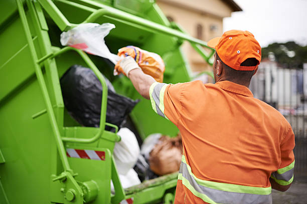 Yard waste removal in Dallas TX crew hauling brush and tree branches